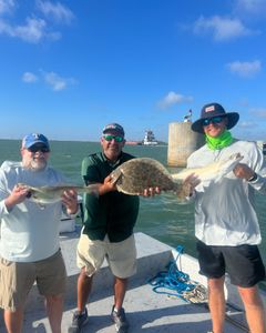 A group of 3 people fishing for 3 spotted weakfish and summer flounder in Texas