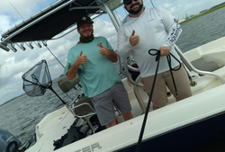 Two people enjoying a fishing tour in Florida