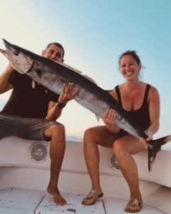 A wahoo fish caught by two people in Pompano Beach