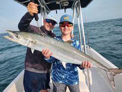 Two people fishing for one big fish in FL