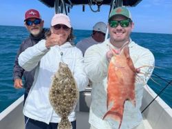Two southern flounder measuring 21 inches, caught in St. Petersburg, Florida