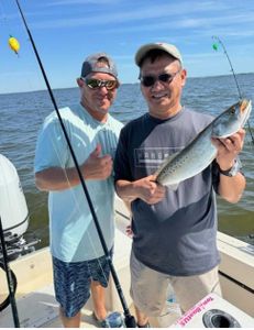Two people enjoying a cruises and fishing trip in Wanchese