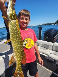 Northern pike caught fishing in Spring Park MN displayed on boat deck