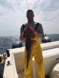 A single fisherman catches a big 30-inch fish in Biloxi