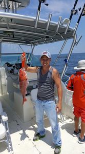 A single fisherman with a catch in Biloxi