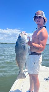 Angler posing with a 26-inch catch in Hernando