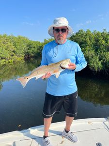 An angler holding a fishing rod in Hernando