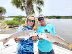 Two mutton snapper and redfish caught while fishing in FL