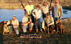 Group of 8 people fishing and hunting in Port Isabel