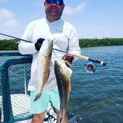 Two 15-inch fish caught while fishing and hunting in TX