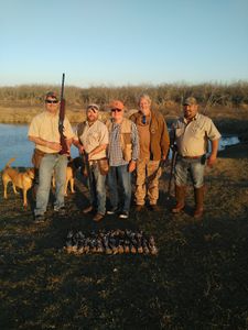Group of 5 people fishing and hunting in Port Isabel