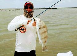 A single fishing enthusiast with a big catch in Port Isabel