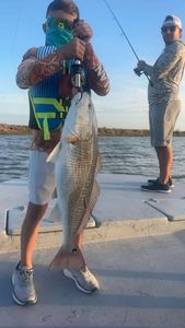 Large redfish catch displayed on boat deck in Matagorda TX