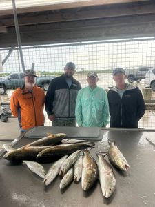 Successful redfish catch displayed on cleaning table at Matagorda TX fishing dock