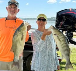 Two anglers fishing for white bass and striped bass in Cleveland