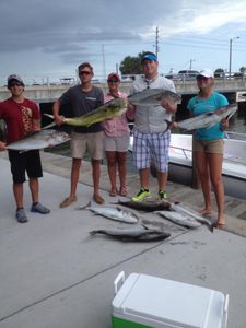 5 people fishing on the coast of New Smyrna Beach