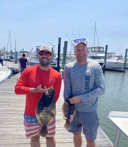 Two people fishing in Longport