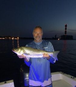 One person fishing in Longport