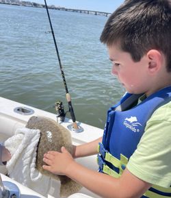 A person fishing in Longport