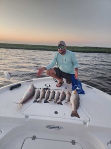 Calm waters and big Redfish action.