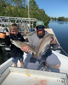 Two anglers fishing for redfish in Spring Hill