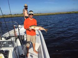 Two anglers with a 35-inch fish in FL