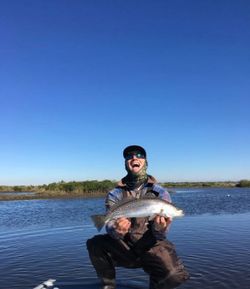 A person fishing with a rod in Spring Hill