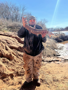 Angler with a 20-inch fish in Norman