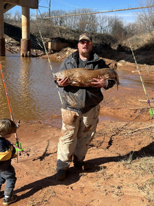 A lone angler fishing in the waters of Norman