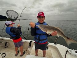 Redfish caught by two people while fishing in Elmendorf
