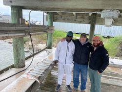 Three people fishing at Rockport
