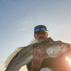 A lone fisherman casting line in Texas