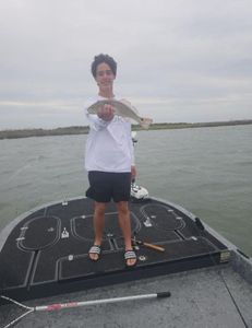 Angler fishing with rod and reel in Rockport