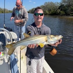 Two people fishing for snook in Tampa, Florida