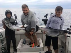 3 people fishing for 2 big fish in Oakville