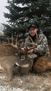 Massive whitetail buck, proud harvest.