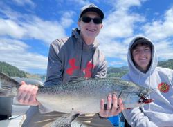 Angler with a rainbow trout catch in OR