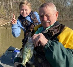Angler holding a 13-inch crappie fish in Hopkinsville
