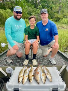 Four people fishing in Panama City Beach