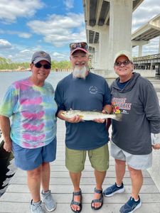 Three people fishing at Panama City Beach