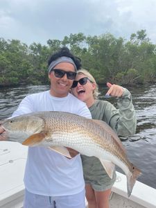 Two people fishing in FL