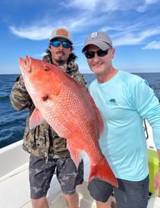 Captain Clay and client with a nice snapper to end the day. 