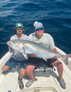 Anglers with a large fish in Pensacola