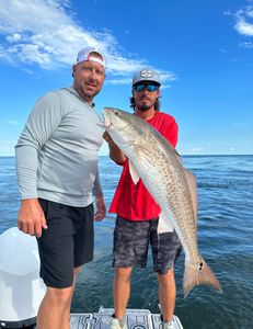 Anglers with a big fish caught in Pensacola