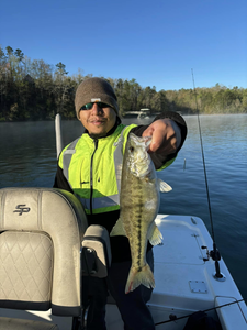 Angler with fishing rod reeling in catch in SC