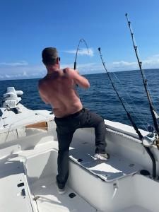 Deep sea fishing charter boat with fishing rods set up off Morehead City NC coast