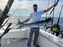 A fisherman catching a Wahoo fish in Morehead City