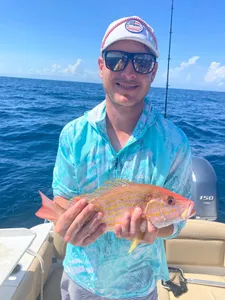 Successful fisherman holding a catch in Florida
