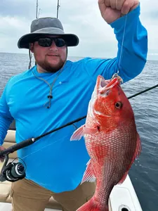 A lone fisherman reeling in his catch in Niceville