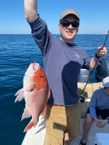 Fisherman holding a 17-inch catch in Niceville